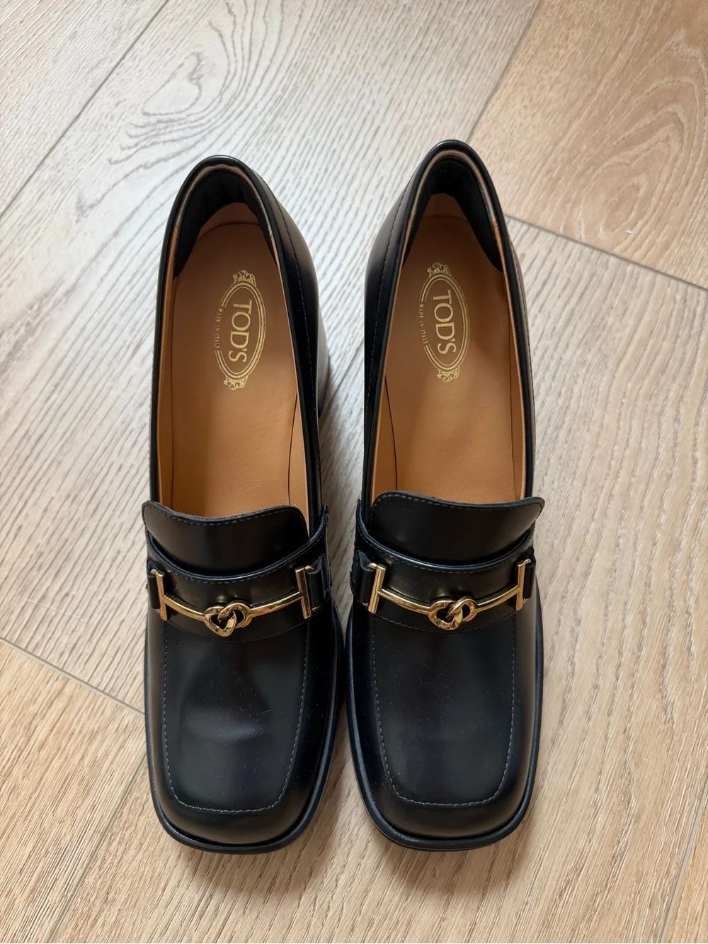 Tod's Black Leather Loafers with Gold Horsebit Detail